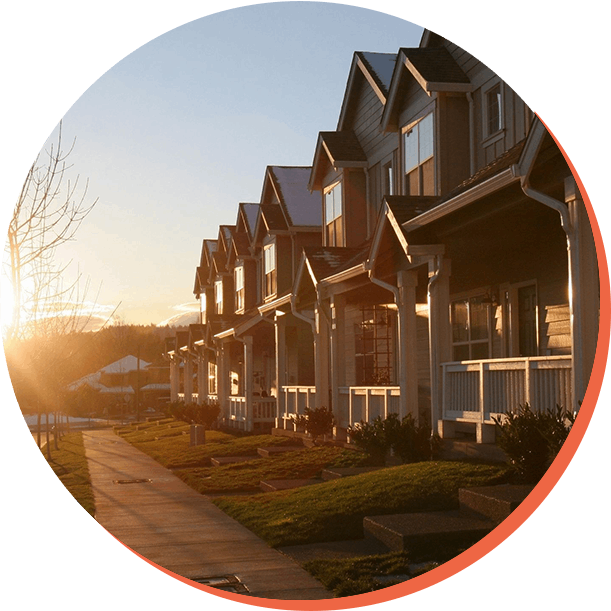 Sunset over family homes in a suburban area