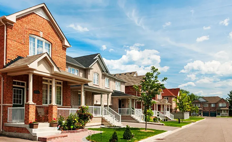 Suburban residential street with red brick houses